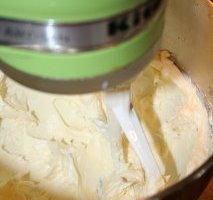Creaming butter to help make cream-cheese frosting