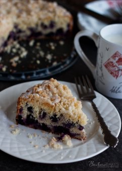 Lemon Blueberry Coffee Cake - Tender, wet lemon coffee dessert loaded with blueberries crowned with a crunchy, nice crumb topping and drizzled with a tart lemon glaze.