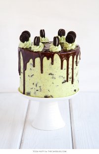 Mint Cookies 'N Cream Cake with crushed cookies in the cake and frosting plus a chocolate drip | by Tessa Huff for TheCakeBlog.com