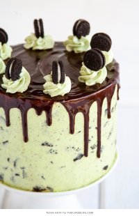 Mint Cookies 'N Cream Cake with crushed cookies in the cake and frosting plus a chocolate drip | by Tessa Huff for TheCakeBlog.com