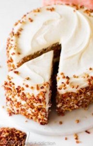 Sally's Baking Addiction | Simple and moist two-layer carrot cake with pecans and cream cheese frosting!