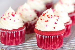ideal purple velvet cupcakes - a striking red colorization, wet and fluffy, and topped with luscious cream cheese frosting.